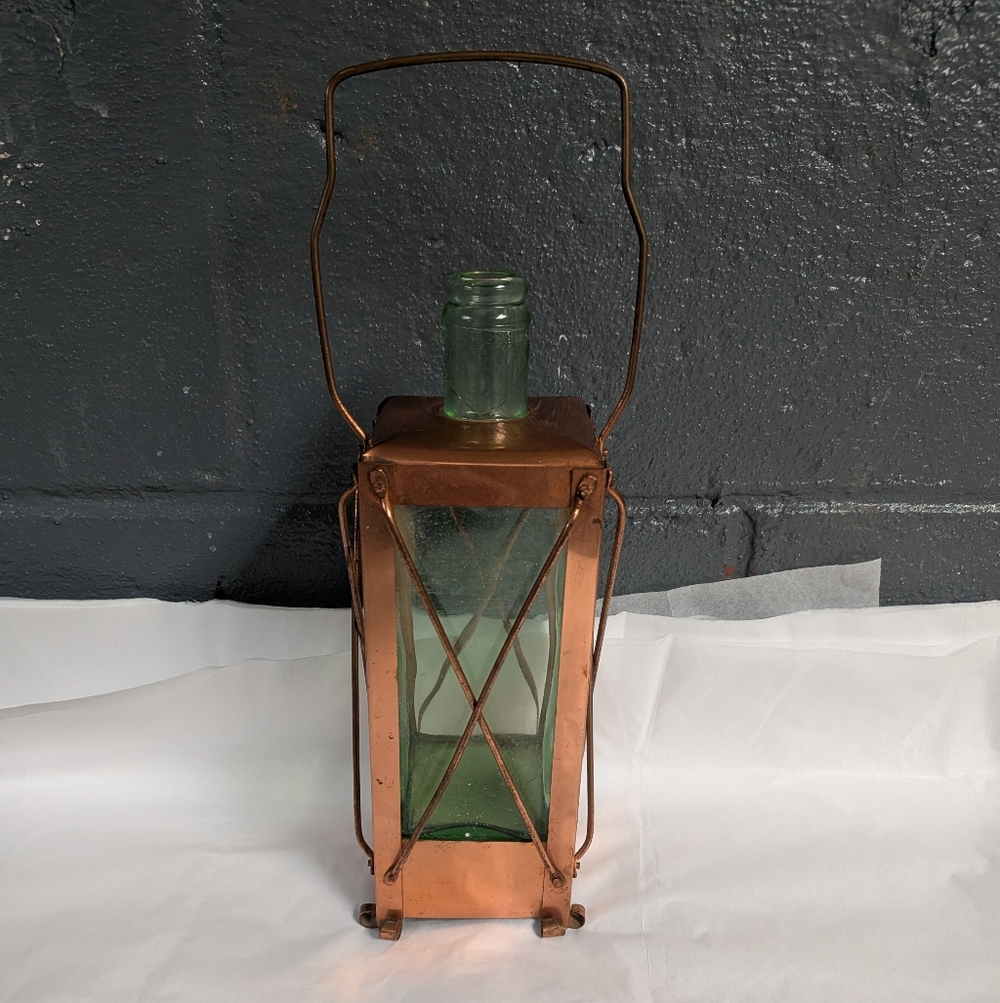 vintage "Handarbete Sweden" musical lantern-style decanter.